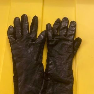 Black leather gloves and they are long past wrist